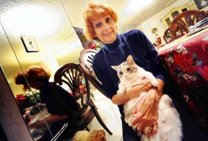 Sunrise--- fl-Ellen-moltz-0109a--Here is Ellen Moltz with her cat, Moxie. Robert Duyos Sun-Sentinel